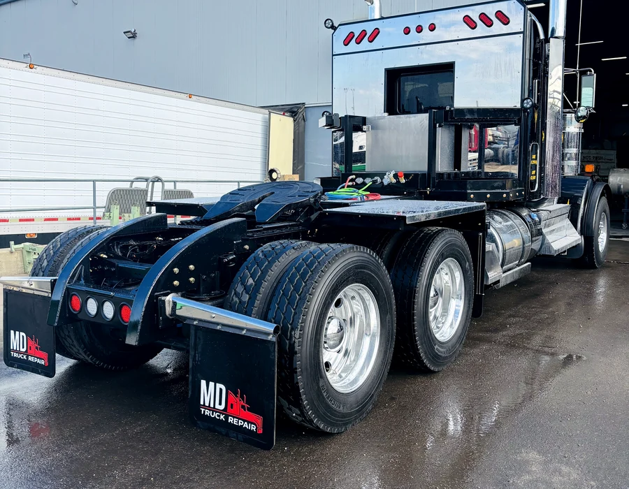 Heavy-duty truck with custom-fabricated rear equipment